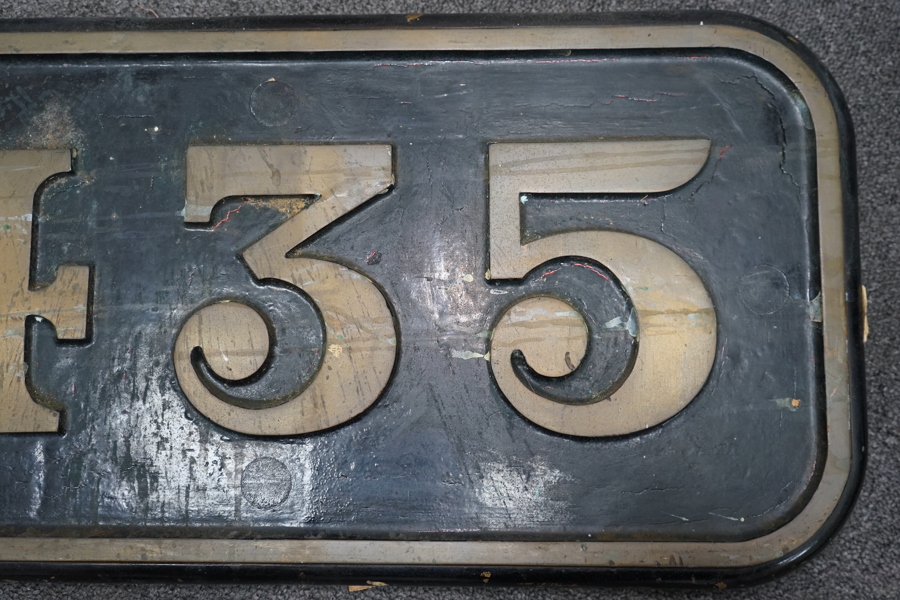 A cast iron GWR locomotive cab side number plate for an 0-6-2T locomotive, 435, built by Robert Stephenson & Co. for the Brecon & Merthyr Railway (No.49), numbered 1668 by GWR, and withdrawn by BR in 1954, dimensions; 59